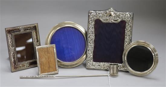 Five assorted photograph frames including four silver, together with a candle snuffer.